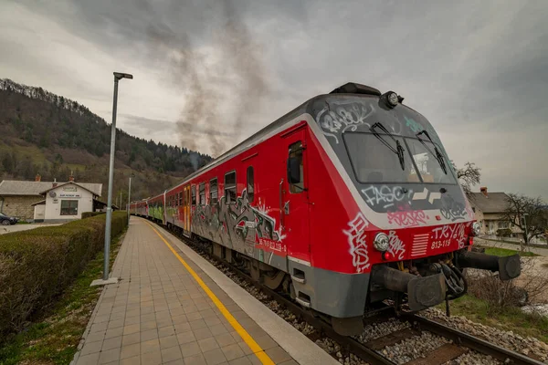 stock image Stop station in Slovenia small village with diesel passenger unit near platform in Podhom 03 30 2023