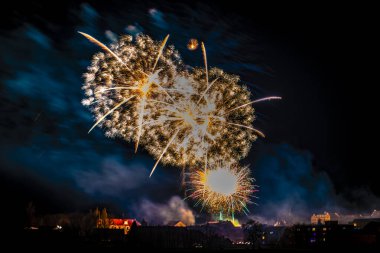 Fireworks near town in south Bohemia in dark night in Protivin CZ 01 01 2024