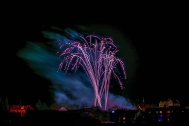 Fireworks near town in south Bohemia in dark night in Protivin CZ 01 01 2024