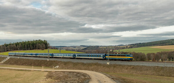 Passenger trains near high speed tunnel in railway stop in Jesetice CZ 02 18 2024
