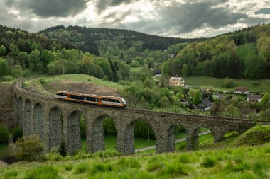 Old stone viaduct near in spring cloudy evening near Novina CZ 05 03 2024 clipart