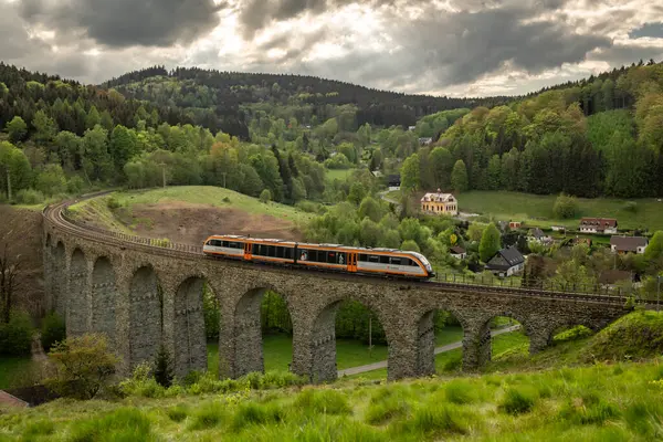 stock image Old stone viaduct near in spring cloudy evening near Novina CZ 05 03 2024