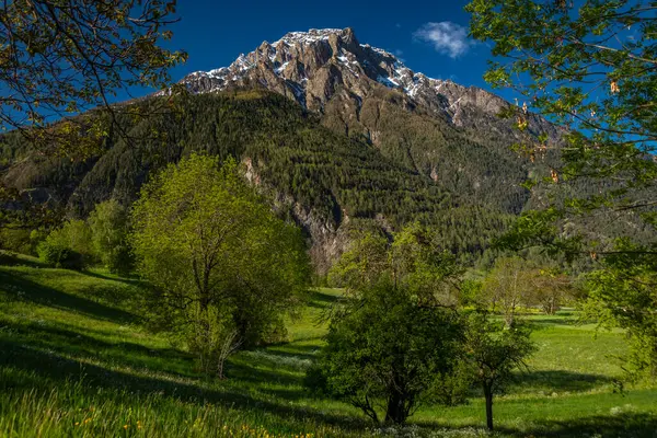 stock image Glishorn and Fulhorn hills near Brig town in spring color fresh morning