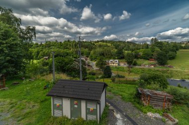 Old houses and views for nice village in Jeseniky mountains in Branna CZ 07 20 2024 clipart