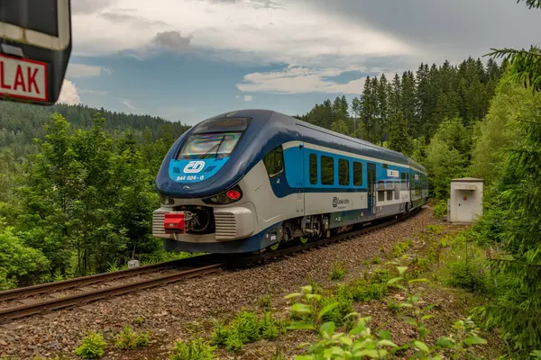 stock image Train near small crossing of road in summer cloudy day in Potucky CZ 06 27 2024