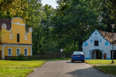 Old village square with color houses in summer day in Opatovice CZ 08 27 2024 clipart