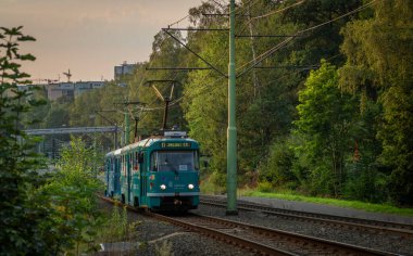 Trams in slope near U lomu stop in summer evening in Liberec CZ 08 30 2024 clipart