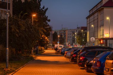 Autumn color evening in streets after sunset in Pardubice CZ 11 16 2024 clipart