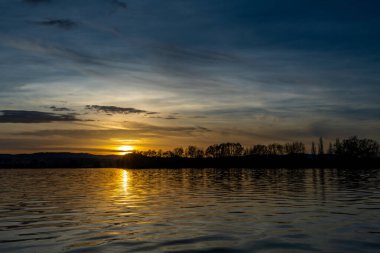 Vysatov pond with sunset color light in autumn sunny evening in south Bohemia clipart