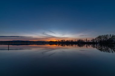 Vysatov pond with sunset color light in autumn sunny evening in south Bohemia clipart