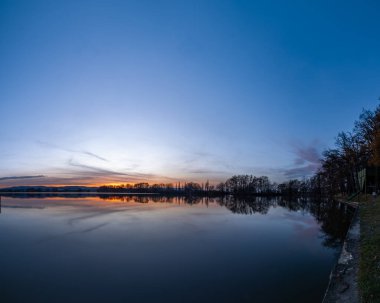 Vysatov pond with sunset color light in autumn sunny evening in south Bohemia clipart