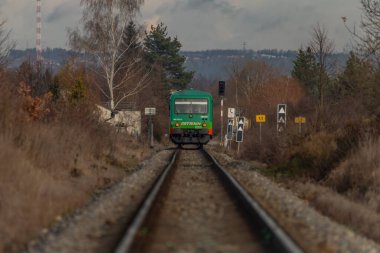 Diesel engine train unit green near city Budweis CZ 12 04 2024 clipart