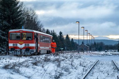 Old unit orange engine with cold winter morning colors in Moldava CZ 12 23 2024 clipart