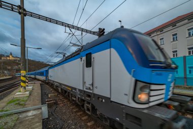 Trains in winter cold dark cloudy day in Usti nad Labem CZ 12 24 2024 clipart