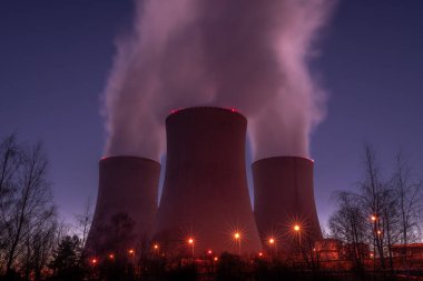 Night with color light in winter cold view for nuclear power plant in Temelin CZ 02 04 2025 clipart