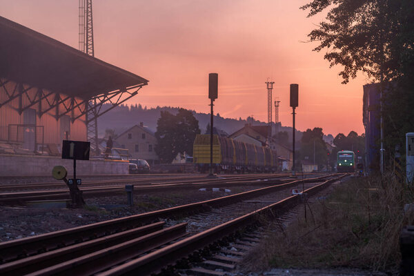 Railway with station in color fresh sunrise morning in Volary CZ 08 15 2025