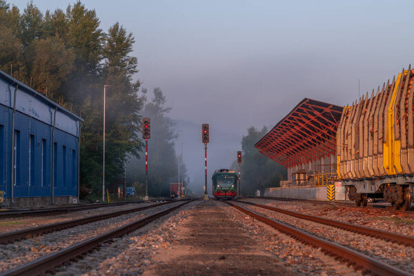Railway with station in color fresh sunrise morning in Volary CZ 08 15 2025