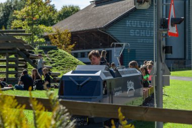 Small railway on green summer meadow in park in Gurten Bern Switzerland 09 06 2025