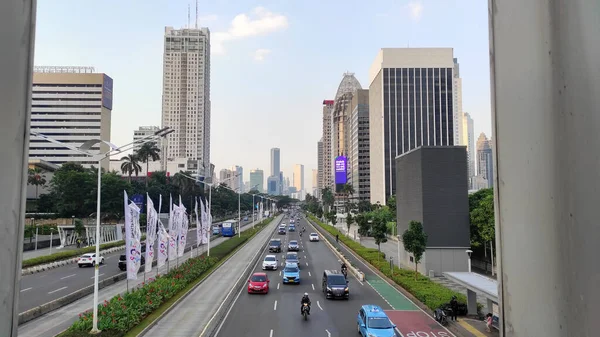 stock image Jakarta, Indonesia - July 10, 2022. Capital highway between skyscrapers with heavy vehicle traffic.