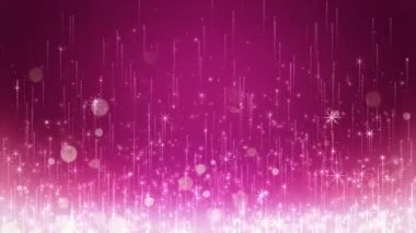 Renkli bir arkaplanda parlayan parçacıkların yükseldiği bir video