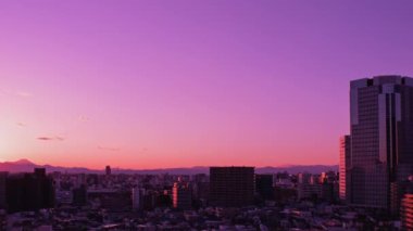 Video of sky, clouds, city and buildings, night view from sunset