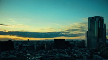 Video of sky, clouds, city and buildings, night view from sunset