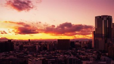 Video of sky, clouds, city and buildings, night view from sunset