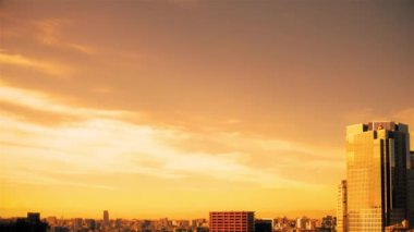 Video of the sky, clouds, towns and buildings, from daytime to sunset