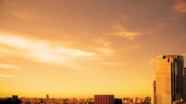 Video of the sky, clouds, towns and buildings, from daytime to sunset