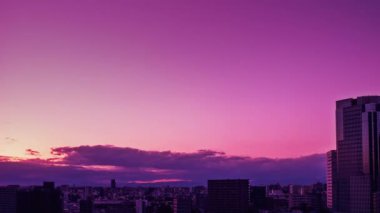 Video of the sky, clouds, towns and buildings, from daytime to sunset