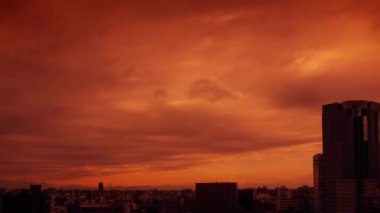 Video of the sky, clouds, towns and buildings, from daytime to sunset