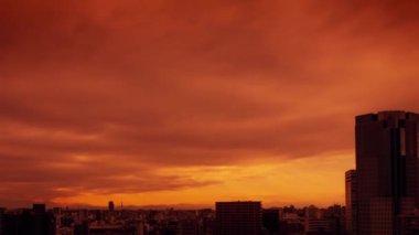 Video of the sky, clouds, towns and buildings, from daytime to sunset