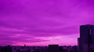 Video of the sky, clouds, towns and buildings, from daytime to sunset