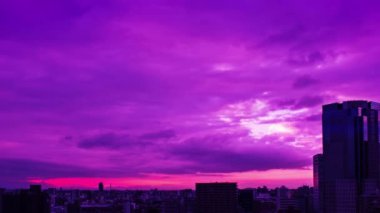 Video of sky, clouds, city and buildings, night view from sunset