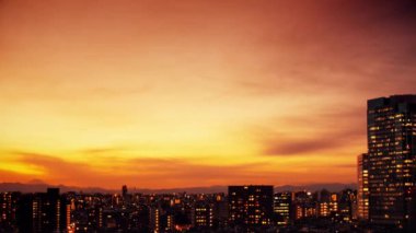 Video of sky, clouds, city and buildings, night view from sunset