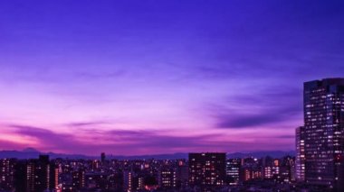 Video of sky, clouds, city and buildings, night view from sunset