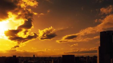 Video of the sky, clouds, towns and buildings, from daytime to sunset