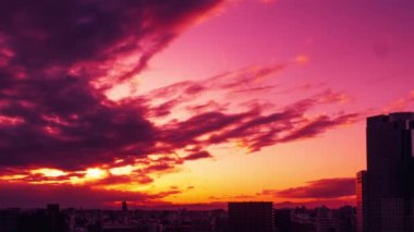 Video of sky, clouds, city and buildings, night view from sunset