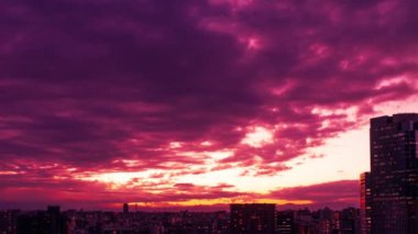 Video of sky, clouds, city and buildings, night view from sunset