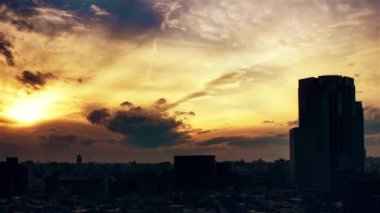 Video of the sky, clouds, towns and buildings, from daytime to sunset