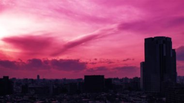 Video of the sky, clouds, towns and buildings, from daytime to sunset