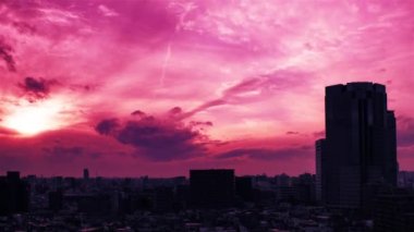 Video of the sky, clouds, towns and buildings, from daytime to sunset