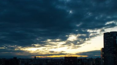 Video of sky, clouds, city and buildings, night view from sunset