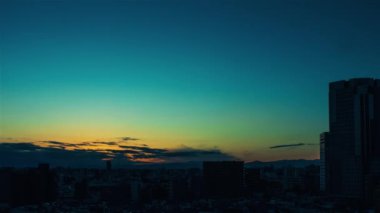 Video of sky, clouds, city and buildings, night view from sunset