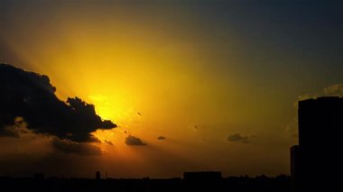 Video of sky, clouds, city and buildings, night view from sunset
