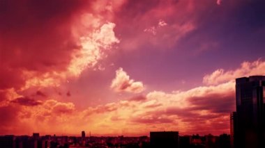 Video of the sky, clouds, towns and buildings, from daytime to sunset