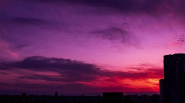 Video of sky, clouds, city and buildings, night view from sunset