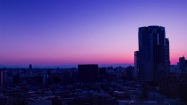 Video of sky, clouds, city and buildings, night view from sunset