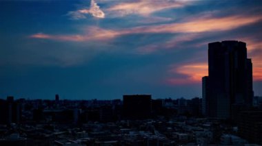 Video of sky, clouds, city and buildings, night view from sunset