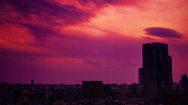 Video of sky, clouds, city and buildings, night view from sunset